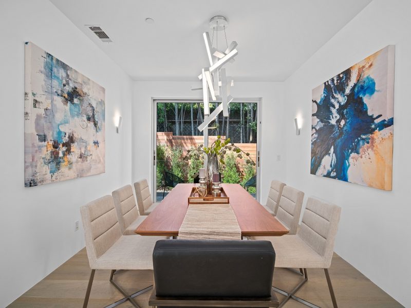 Dining room with modern light fixture